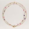 Driedubbele ketting met roze en paarse kraaltjes